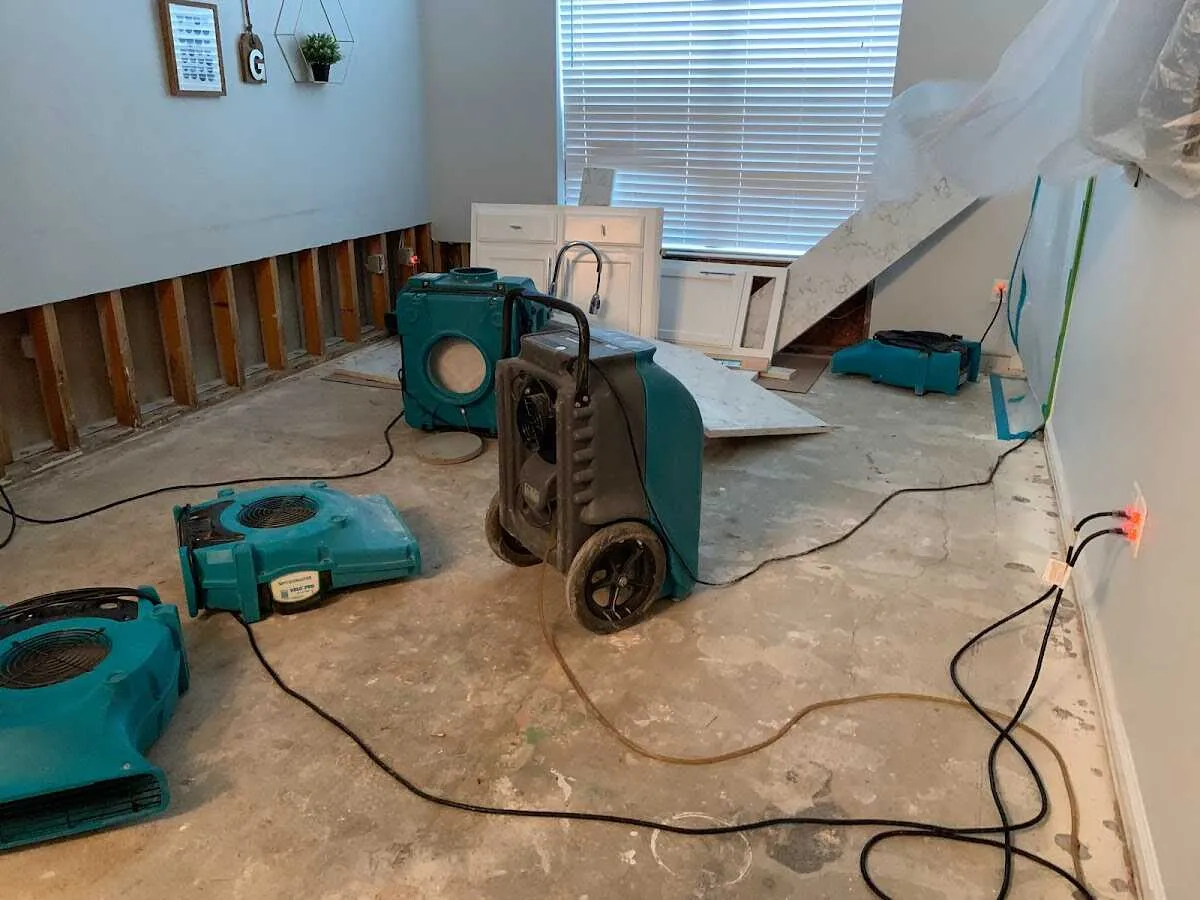 Dehumidifier in flood-cut room for Water Damage Restoration in Stonington